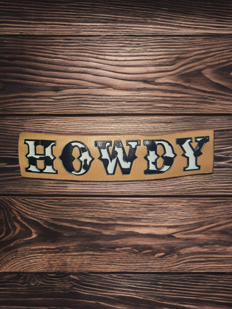 FAUX LEATHER COW PRINT HOWDY BARRETTE