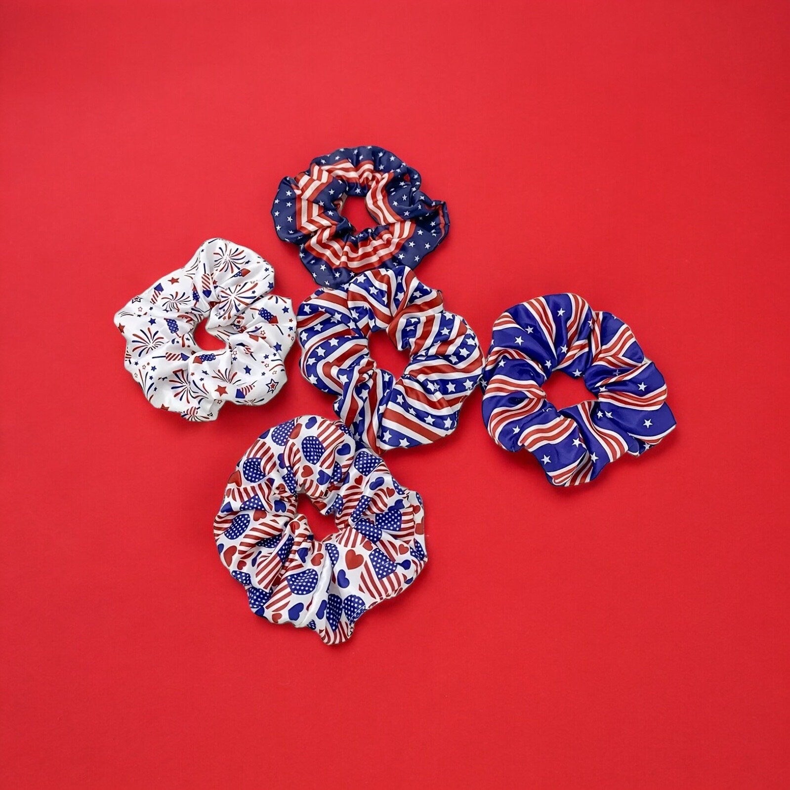 5 scrunchies in various red, white and blue colored 4th of July themed prints.