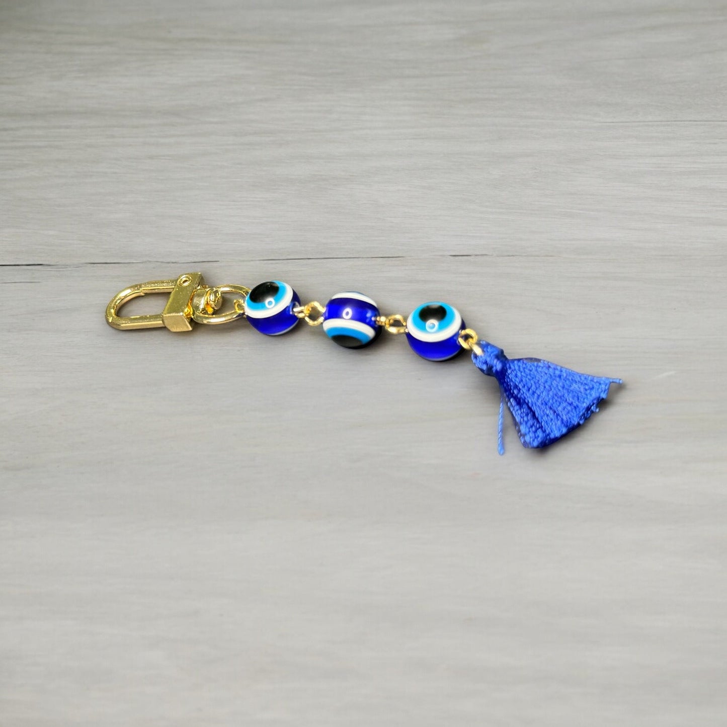 GOLD EVIL EYE BEADED TASSEL KEYCHAIN