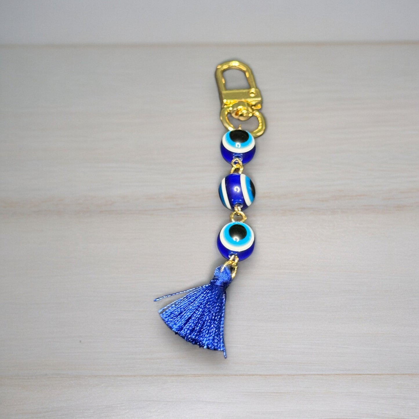 GOLD EVIL EYE BEADED TASSEL KEYCHAIN