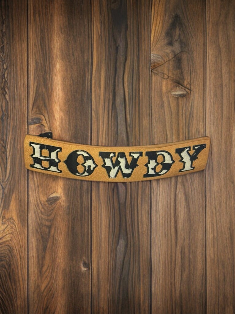 FAUX LEATHER COW PRINT HOWDY BARRETTE