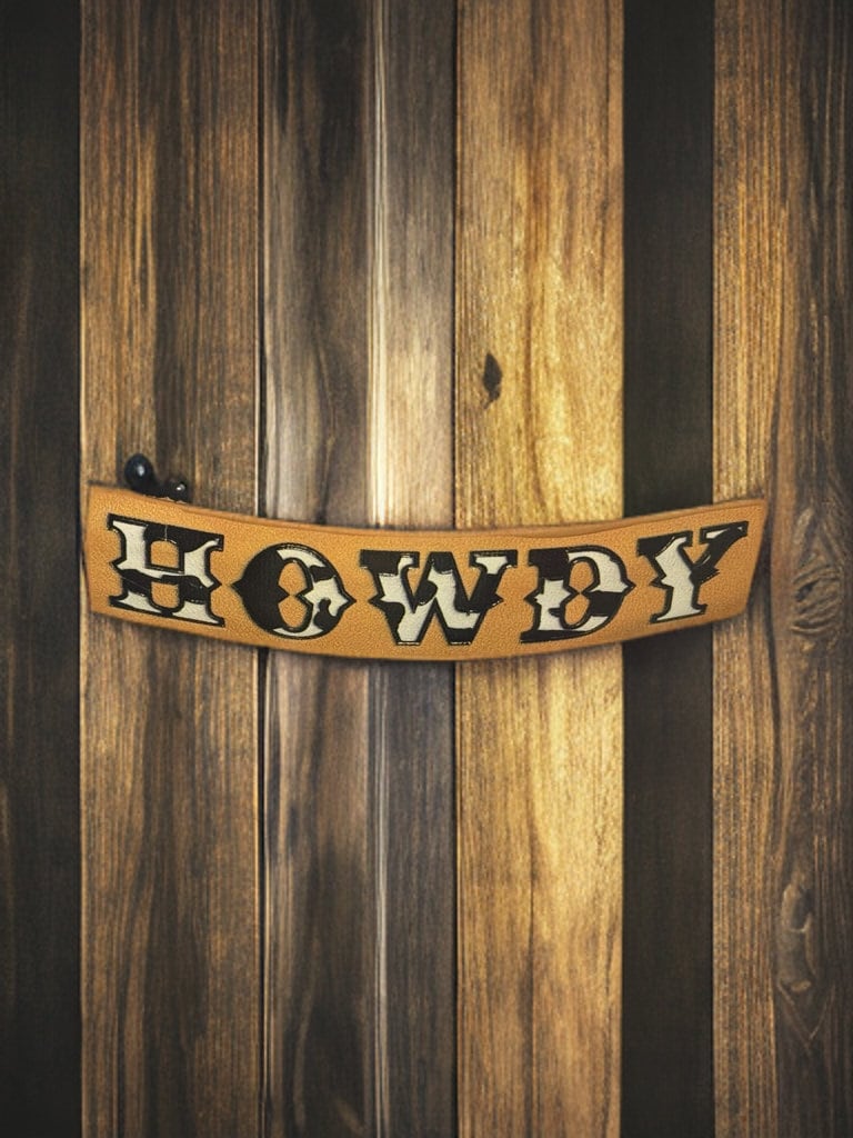 FAUX LEATHER COW PRINT HOWDY BARRETTE