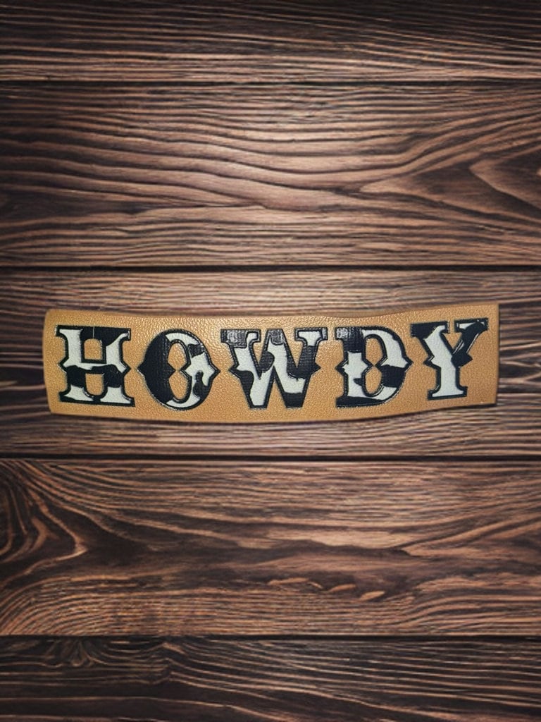 FAUX LEATHER COW PRINT HOWDY BARRETTE