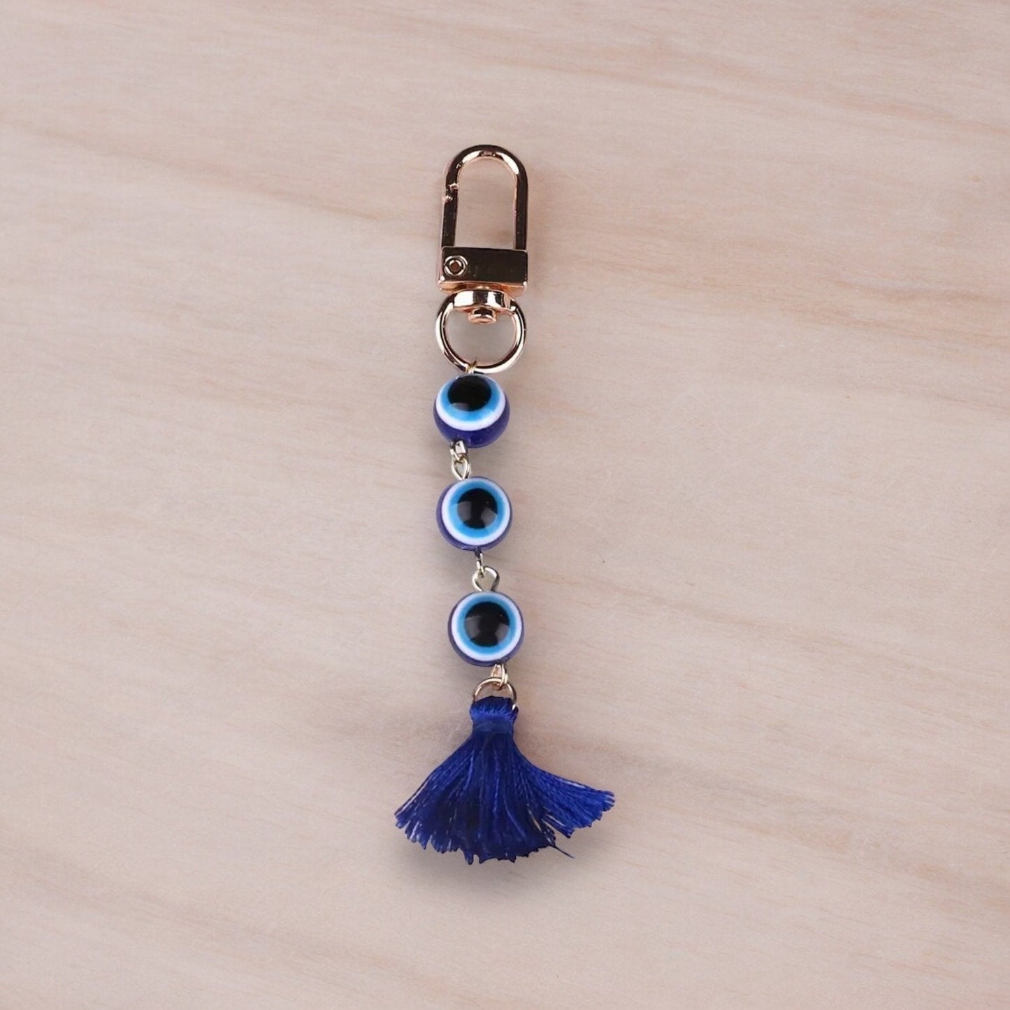 GOLD EVIL EYE BEADED TASSEL KEYCHAIN