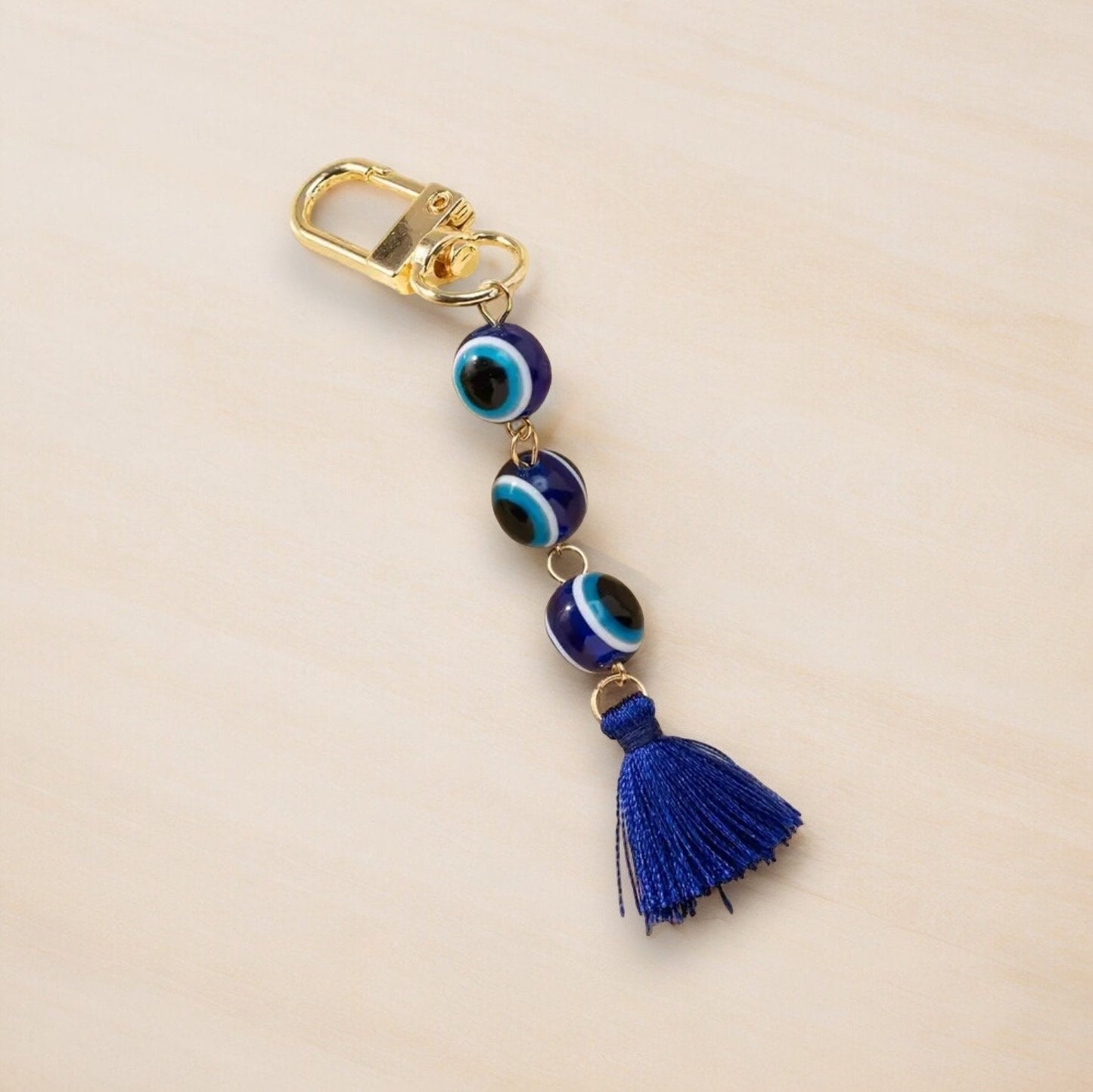 GOLD EVIL EYE BEADED TASSEL KEYCHAIN