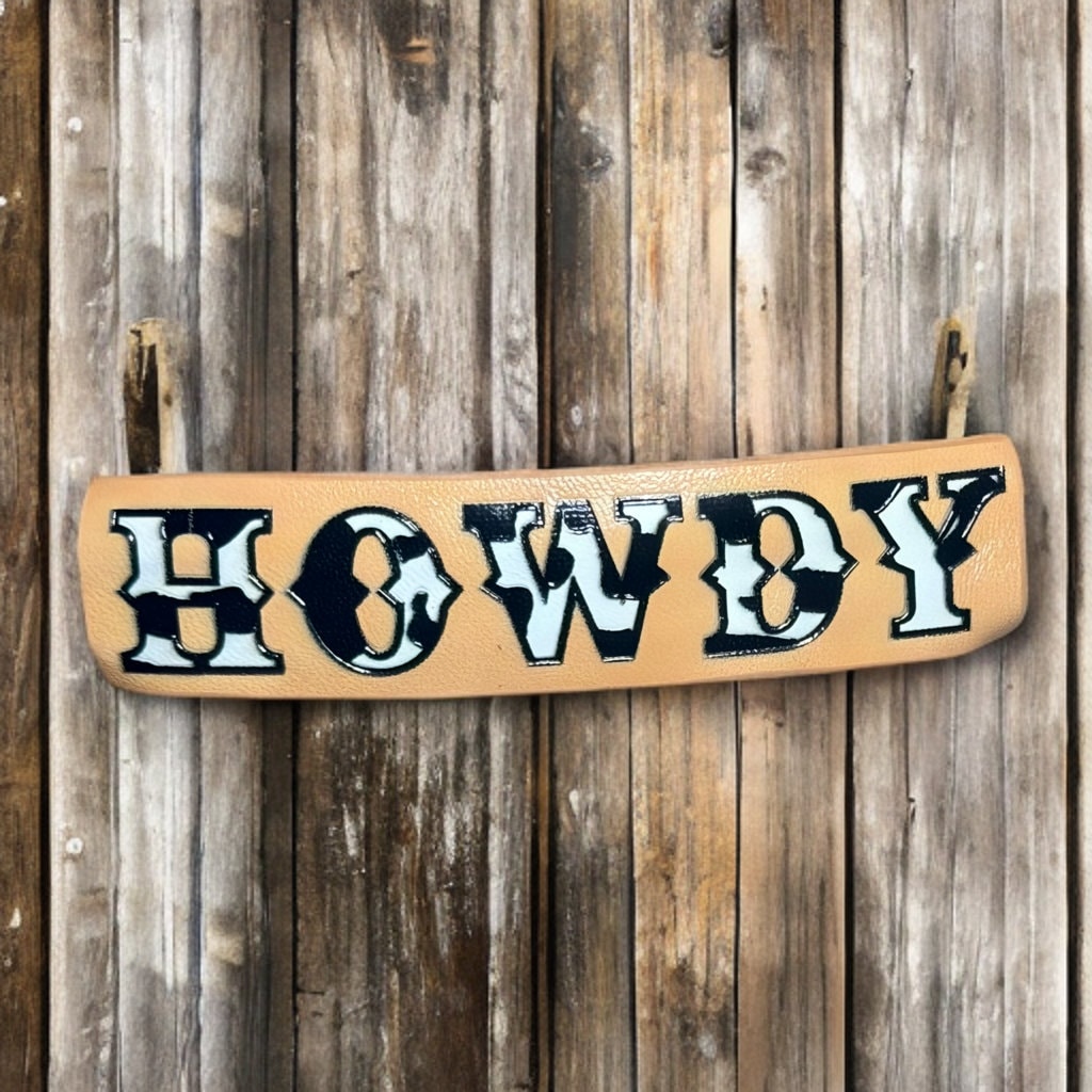 FAUX LEATHER COW PRINT HOWDY BARRETTE