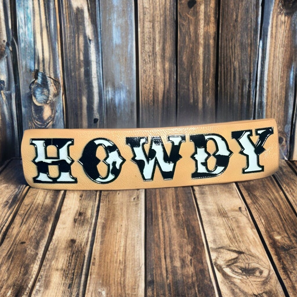 FAUX LEATHER COW PRINT HOWDY BARRETTE